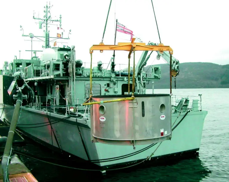 The underwater cofferdam is lowered into position.