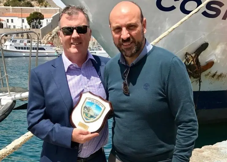 Tony Allen (North P&I Director - Greece), left, and Vassilis Stavropoulos, Academy Director, Hydra Merchant Marine Academy with a commemorative shield presented in recognition of North’s support
