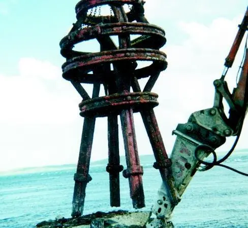 Steel frame standing on the rock face supported a steel formwork for the towers concrete deck.