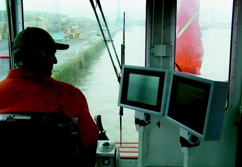 A technician from Seatec checks the Dippermaster backhoe control system.