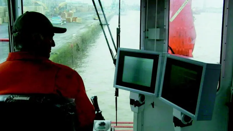 A technician from Seatec checks the Dippermaster backhoe control system.