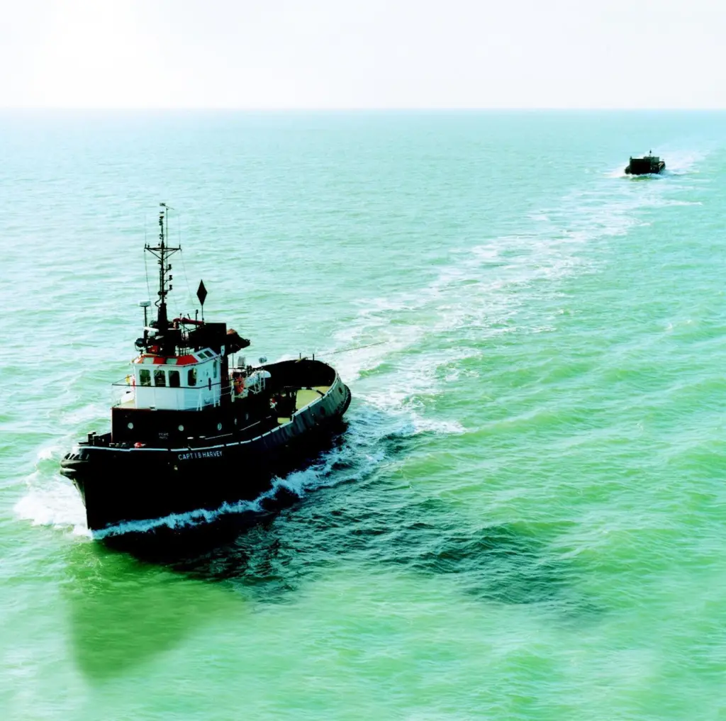 The Capt I B Harvey is shown towing a Van Oord ACZ barge from North Wales to Holland.
