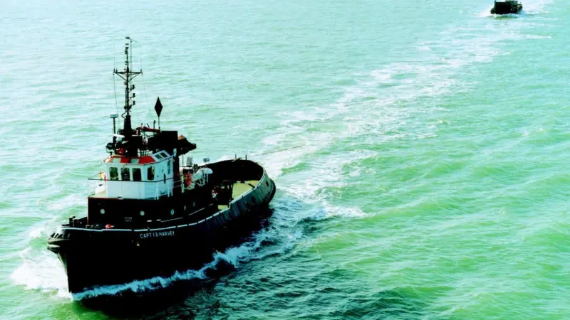 The Capt I B Harvey is shown towing a Van Oord ACZ barge from North Wales to Holland.