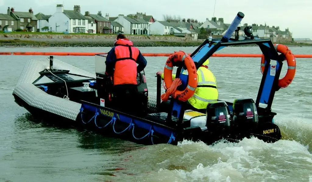 The MCAs new Sea Rover is shown during a boom laying exercise.