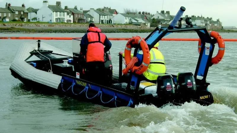 The MCAs new Sea Rover is shown during a boom laying exercise.