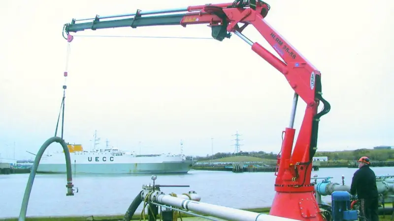 A dock terminal operator tries out the hose handling capability of the newly installed Heila marine crane at Northumberland Dock.