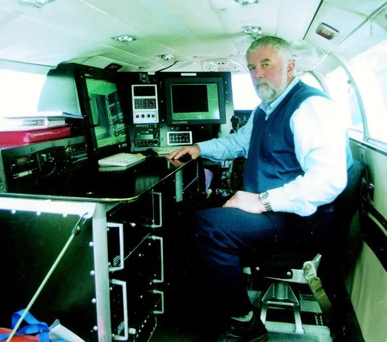 Atlantic Reconnaissance Technical Director Roger Stockham at the surveillance console he designed for the MCA.