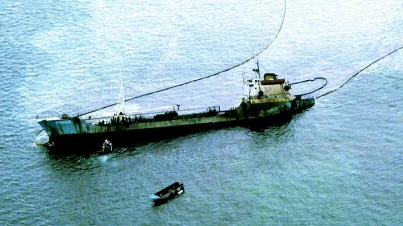 Containment booms surround the stricken Jessica off the Galapagos last year.
