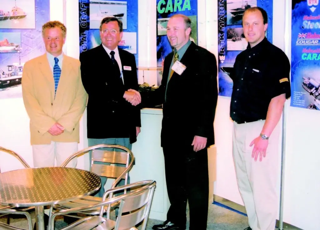 In a signing ceremony at seawork2002, Halmatics Ian Strugnell and D. Ferran and Sons Justin Ferran (left and right centre) are flanked by Tony Ward of Volvo Penta and Andrew Stammers of Jotun.