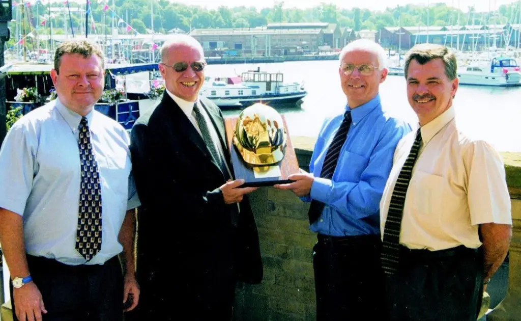 Centurion Safety Products UK Sales Manager David Nevin presents Ivan Ransby with the Centurion Golden Helmet at the Old Custom House in Ipswich.