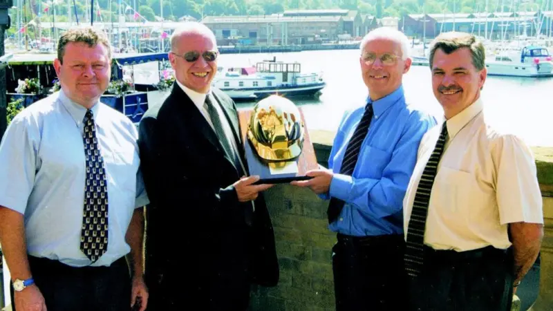 Centurion Safety Products UK Sales Manager David Nevin presents Ivan Ransby with the Centurion Golden Helmet at the Old Custom House in Ipswich.