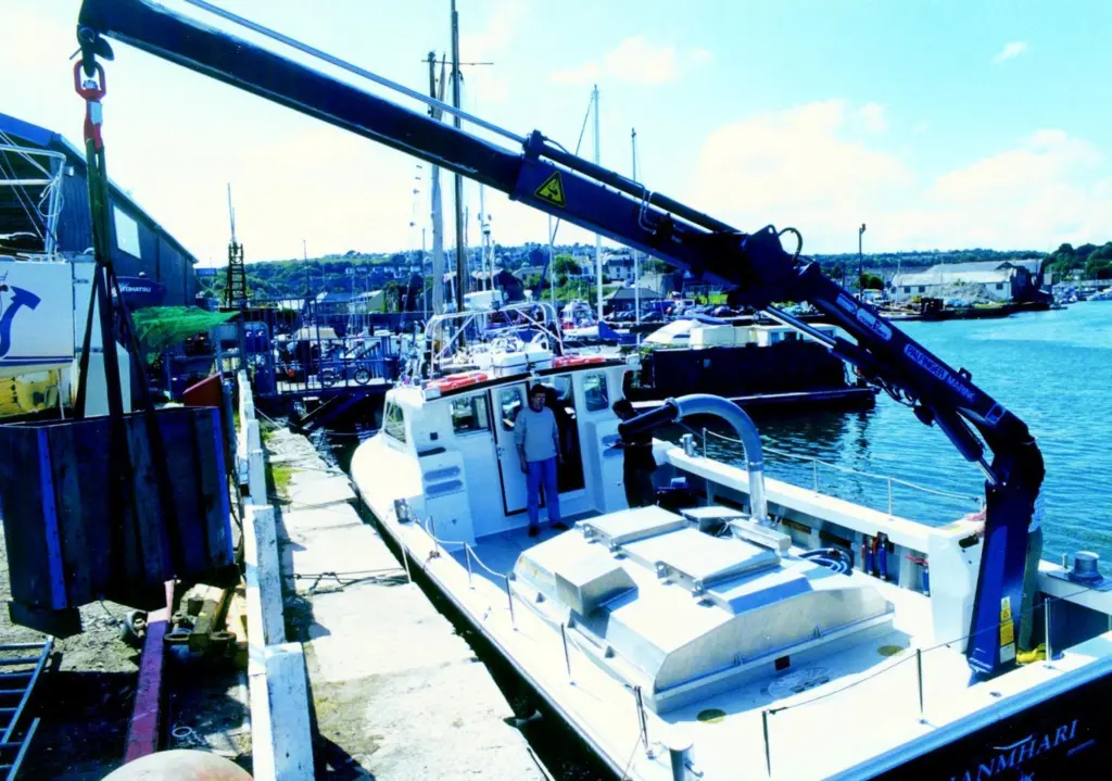 The Shanmharis Palfinger hydraulic crane makes easy work of heavy salmon feed containers.
