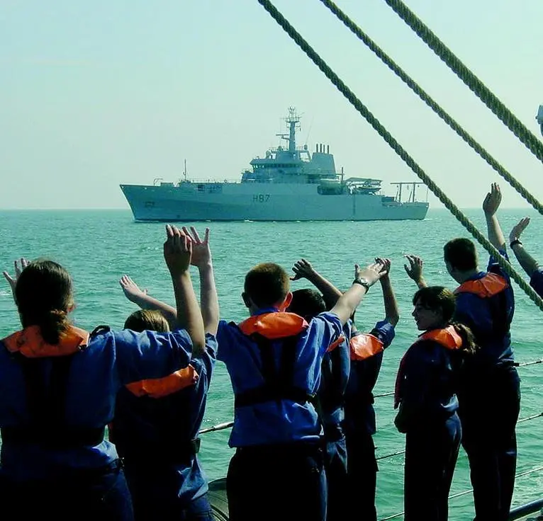 Sea Cadets aboard the former HMS Echo greet the recently commissioned namesake off Portsmouth.