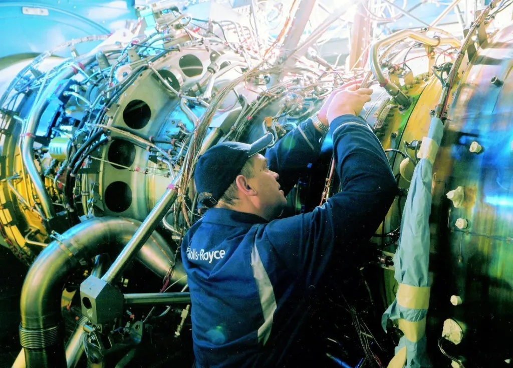 A Rolls Royce technician at work on the Bristol UK test engine.
