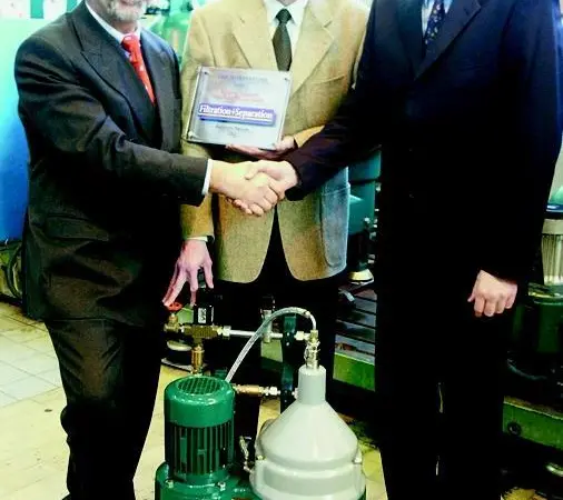 Westfalia Separator Mineraloil Systems managers and engineers are shown with their winning product.