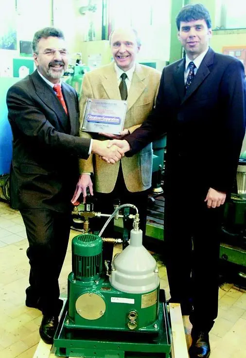 Westfalia Separator Mineraloil Systems managers and engineers are shown with their winning product.