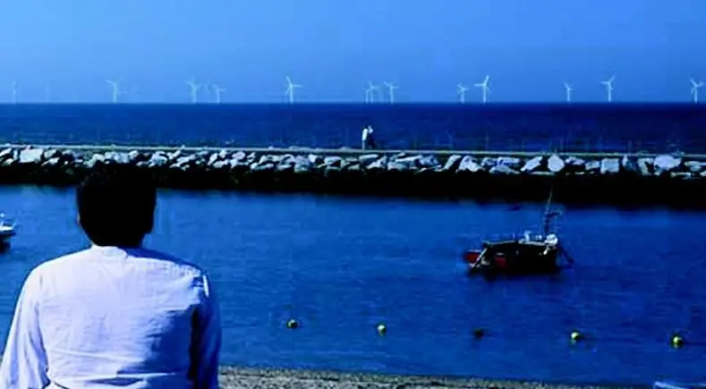 A visualisation of what the windfarm would look like as seen from near the clocktower at Herne Bay .This image was generated by taking a high-quality photograph of the coast and super-imposing 30 turbines of a similar scale as proposed for the project.