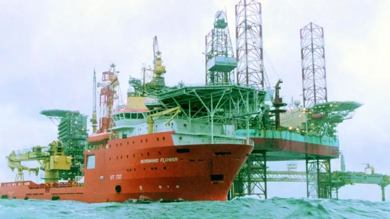 Seacores C100 heave compensated drill at work on board DP3 class vessel Normand Flower as the craft holds station only 40m from an offshore platform.
