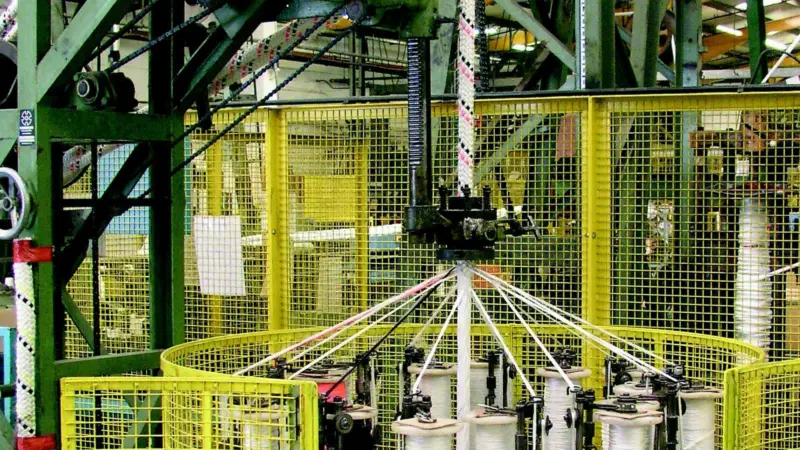 A tough outer jacket is woven onto a Steelite rope during manufacture at the Marlow works.