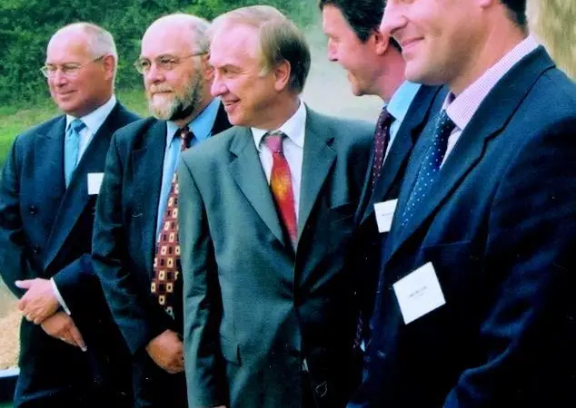 Transport Minister David Jamieson MP (centre) moments after starting the conveyor delivery to the barge.