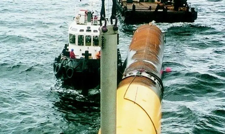 The monopiles are towed out to Excalibur and attached to the crane with a special male to female spear and latching system prior to a buoyant lift into the vertical.