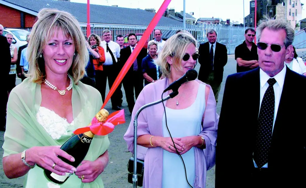 Klyne Director Mrs Waveny Ley prepares to christen the new tug, supported by Mr & Mrs Roger Klyne.