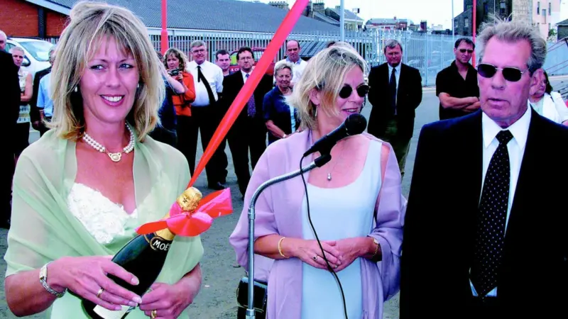 Klyne Director Mrs Waveny Ley prepares to christen the new tug, supported by Mr & Mrs Roger Klyne.