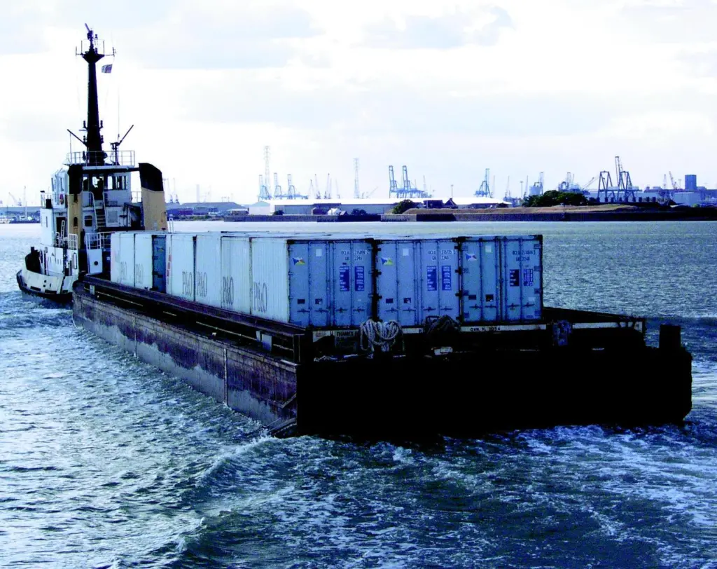 The Adsteam tug Sun Thames delivers 50 containers to the Thames in a single barge.