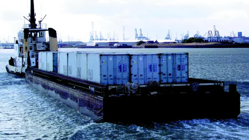 The Adsteam tug Sun Thames delivers 50 containers to the Thames in a single barge.