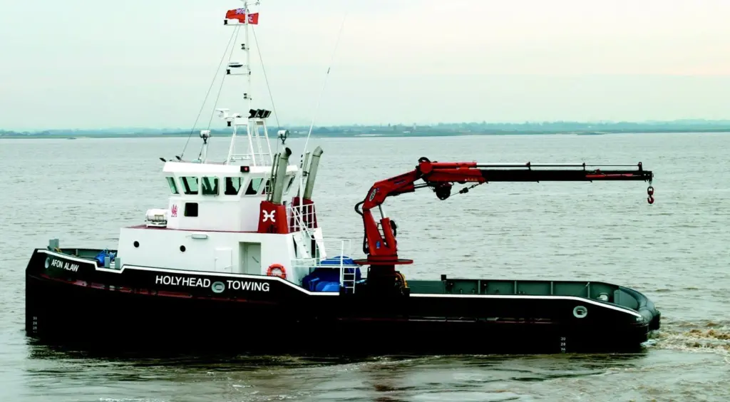 A full width console has three sets of propulsion controls and a comprehensive array of display screens.