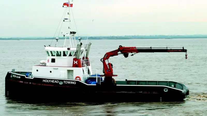 A full width console has three sets of propulsion controls and a comprehensive array of display screens.