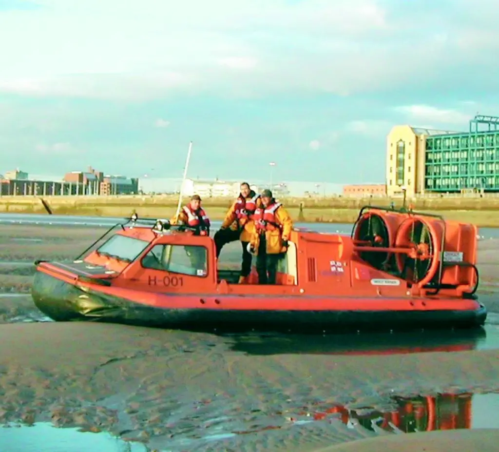 One of the RNLIs Search and Rescue Griffon hovercraft demonstrates its versatility in the Port of Liverpool.