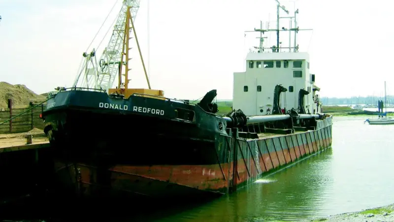 Bow and error. The Donald Redford alongside the Lafarge Aggregates yard on Fareham Creek earlier this month.