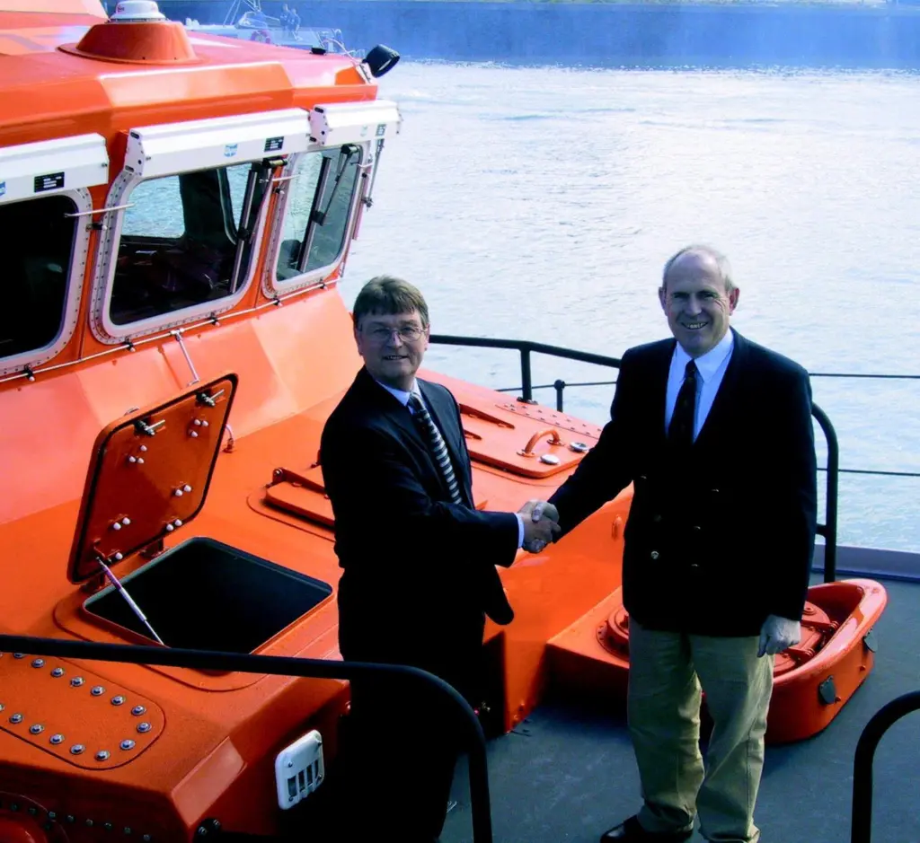 RNLI Director Michael Vlasto accepts ON 1276 into the fleet, presented on behalf of Souter Marine by Assistant Director Terry Lowe.