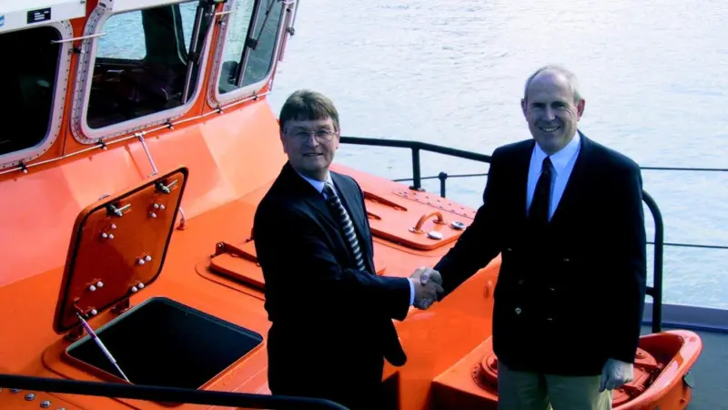 RNLI Director Michael Vlasto accepts ON 1276 into the fleet, presented on behalf of Souter Marine by Assistant Director Terry Lowe.