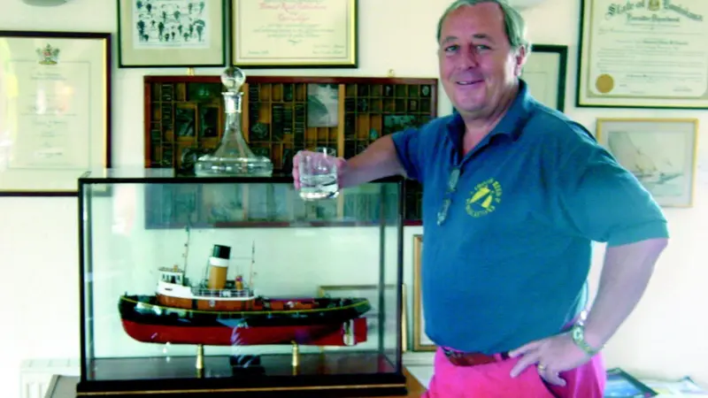 Mr Allan Brunton-Reed with the tug model presented to him at ITS.