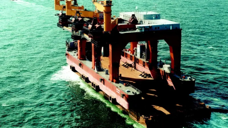 Barge AMT Trader of Anchor Marine Transportation is shown leaving for the 6000 mile voyage from Gdansk to Iskendrun in Turkey - transporting the new 5694 tonne coal trans-shipper Isken.