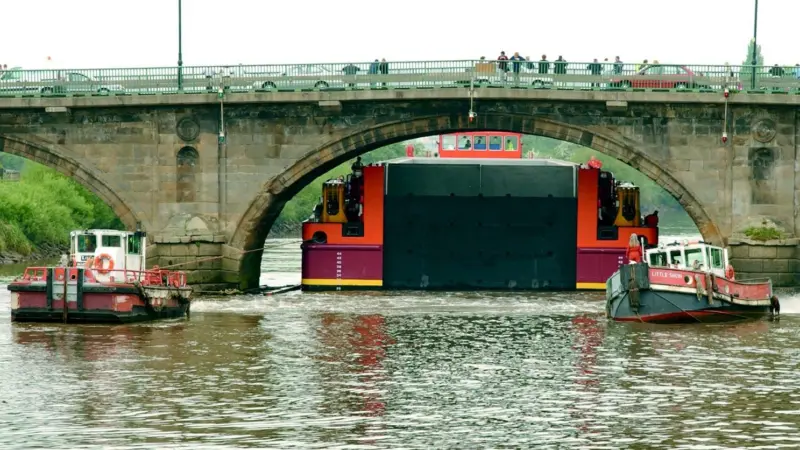 Made to measure. Terra Marique squeezes through the Gainsborough bridge on the River Trent.