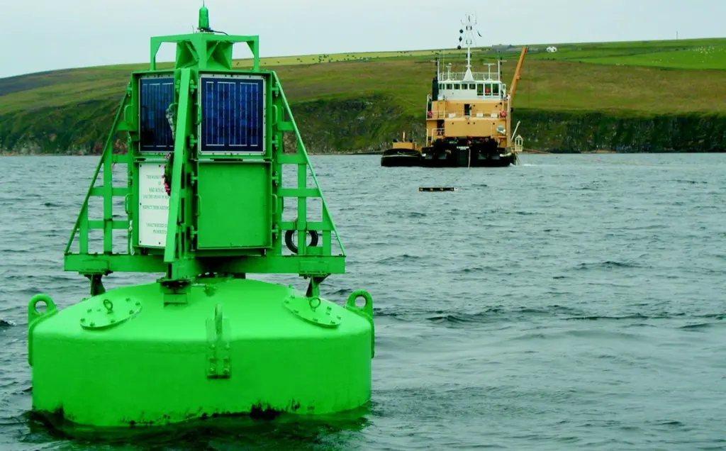 The Briggs support vessel MV Cameron at work beside the HMS Royal Oak war grave buoy.