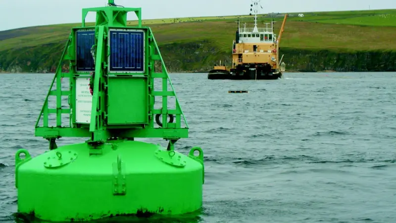 The Briggs support vessel MV Cameron at work beside the HMS Royal Oak war grave buoy.
