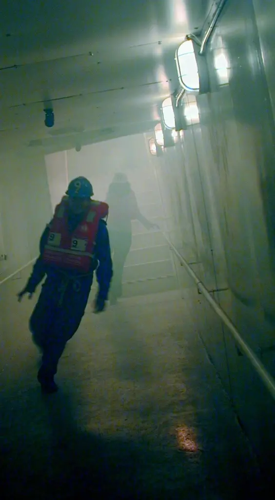 EU co-funded ship evacuation trials have volunteer passengers negotiating a large scale smoke-filled test facility capable of dynamic motion superimposed over an angle of heel.