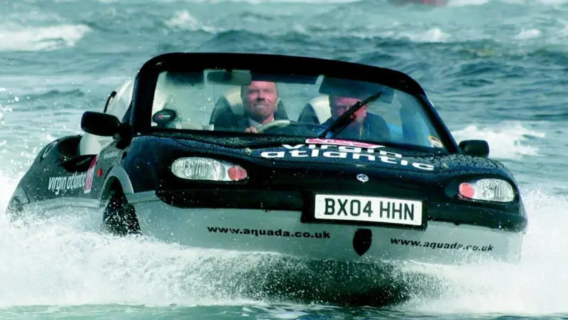 Richard Branson knocks six hours off the record for crossing the English Channel in a car boat.