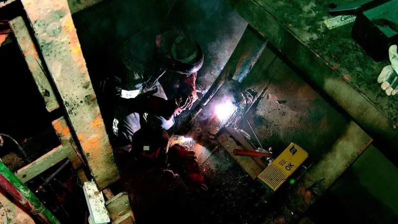Welding underway in the vessels ballast tank.