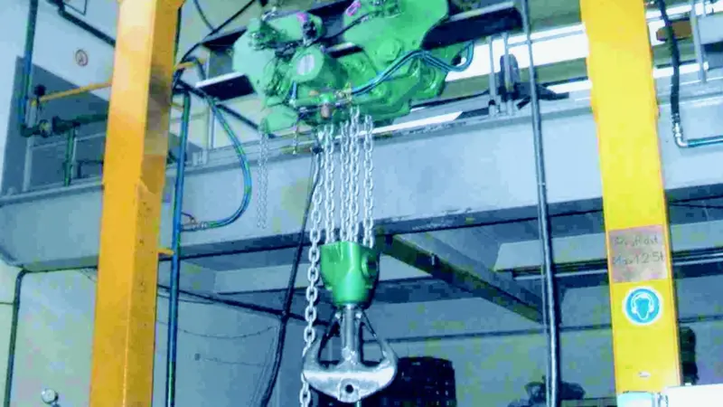 Ram hook with shackle bore lifting attachment during production tests when fitted to EH 50 pneumatically operated monorail hoist, supplied by J D Neuhaus for use at an American shipyard.