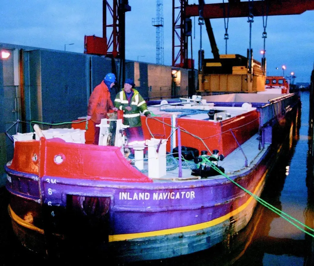 Inland Navigator is brought into the flooded hold of mother ship Terra Marique