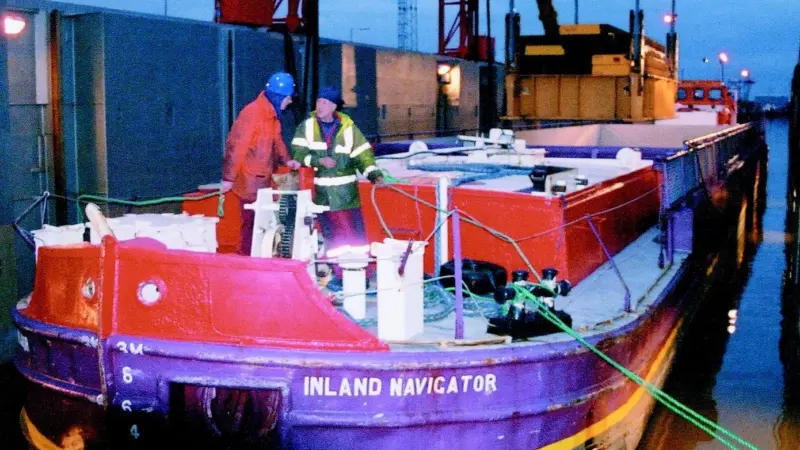 Inland Navigator is brought into the flooded hold of mother ship Terra Marique