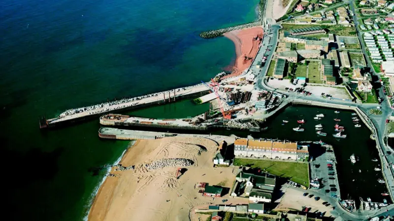 Costains work at West bay included a new West Arm,  and work on the existing, Grade II listed East Pier.