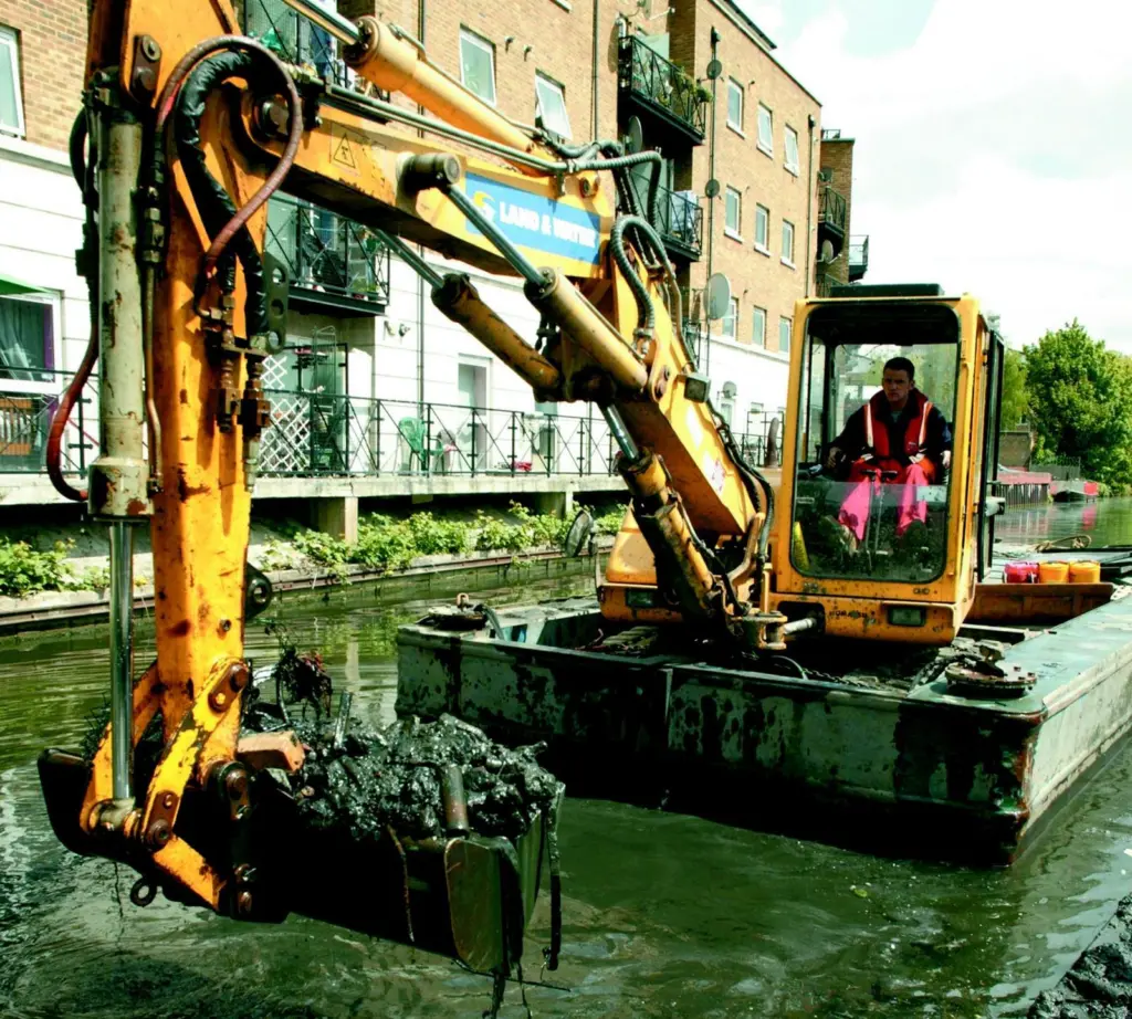 Land & Waters work includes dredging bridge holes and problem areas to accommodate freight barges.