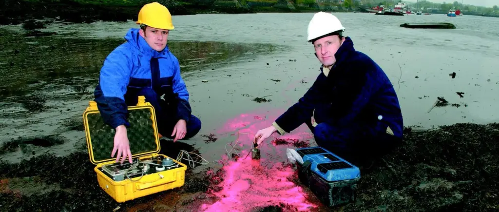 Dr Black (left) and his partner Sam Athey testing sediment movement on the River Clyde.