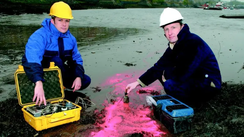 Dr Black (left) and his partner Sam Athey testing sediment movement on the River Clyde.